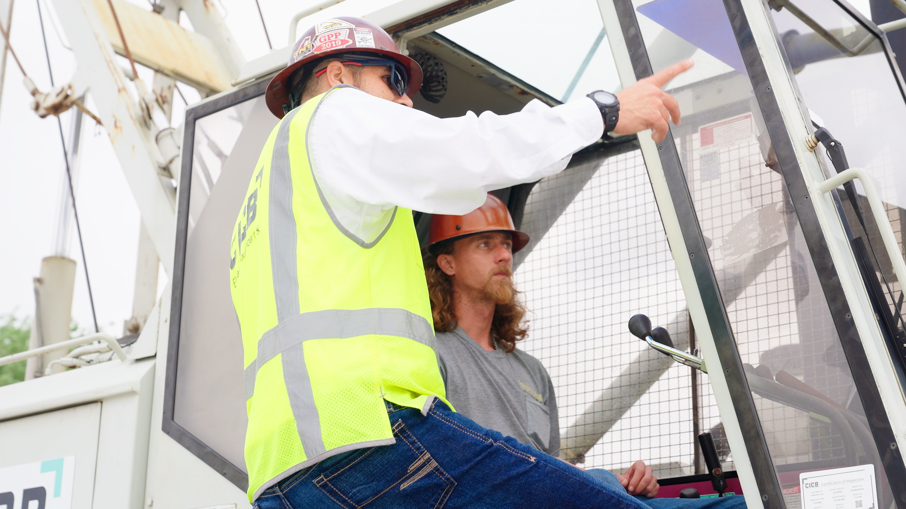 Instructor teaching to Operate Crane